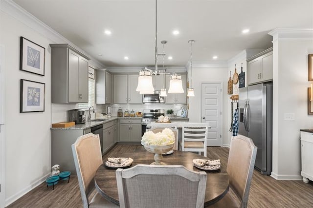 dining area featuring dark wood-type flooring, ornamental molding, baseboards, and recessed lighting