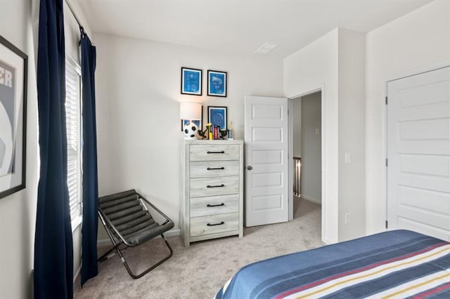 bedroom with carpet and baseboards
