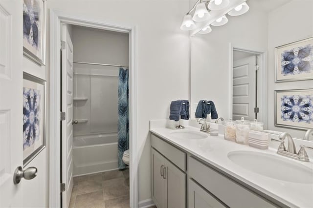 bathroom featuring double vanity, shower / tub combo, and toilet