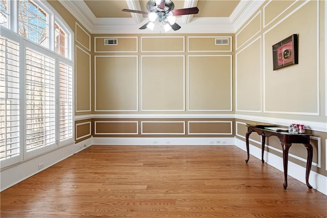 interior space featuring visible vents and ceiling fan