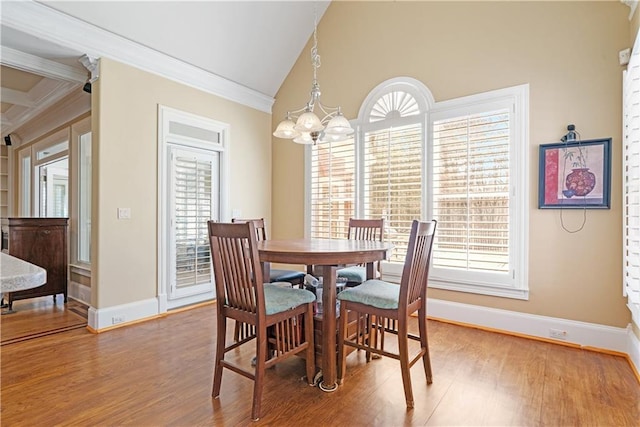 dining room featuring plenty of natural light, light wood-type flooring, and a chandelier