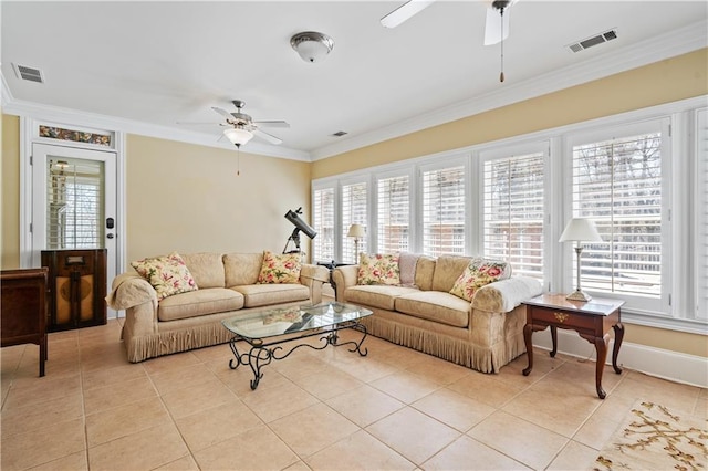 living area featuring crown molding, visible vents, and a wealth of natural light