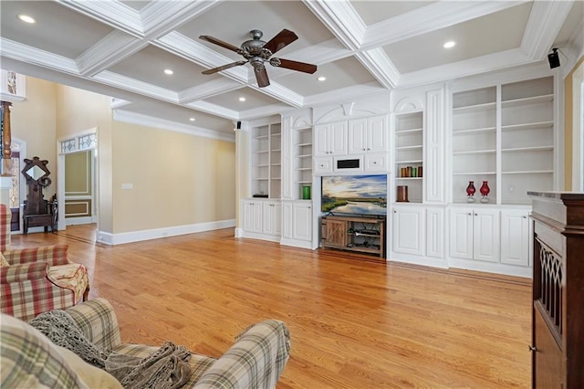 living area with beam ceiling, light wood finished floors, coffered ceiling, and baseboards