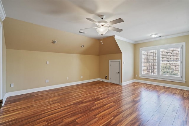 bonus room with visible vents, baseboards, lofted ceiling, wood finished floors, and a ceiling fan