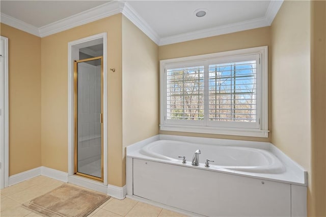 full bath featuring tile patterned floors, a garden tub, a stall shower, ornamental molding, and baseboards