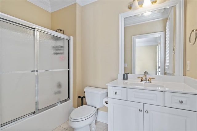 full bathroom with tile patterned flooring, toilet, ornamental molding, combined bath / shower with glass door, and vanity