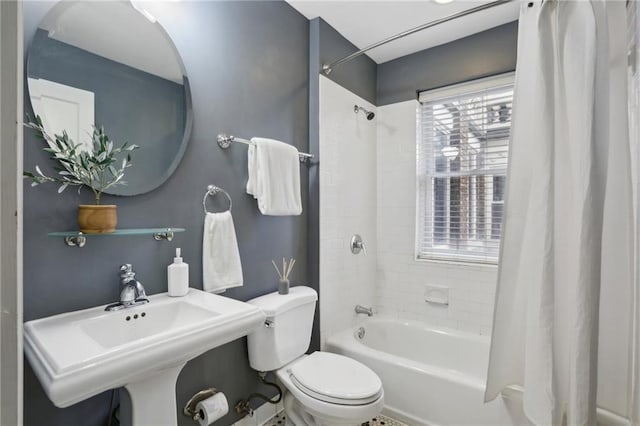 full bathroom featuring shower / bath combo, sink, and toilet