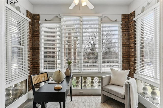 sitting room featuring ceiling fan