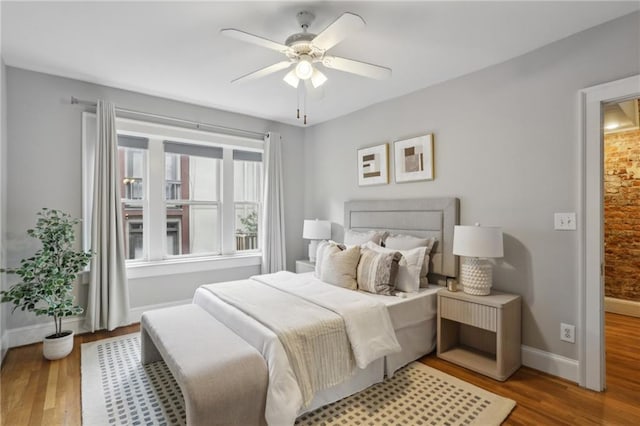 bedroom featuring hardwood / wood-style floors and ceiling fan