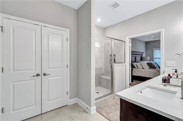 bathroom featuring vanity and a shower with door