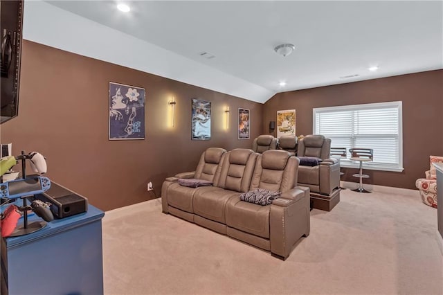 carpeted cinema featuring lofted ceiling