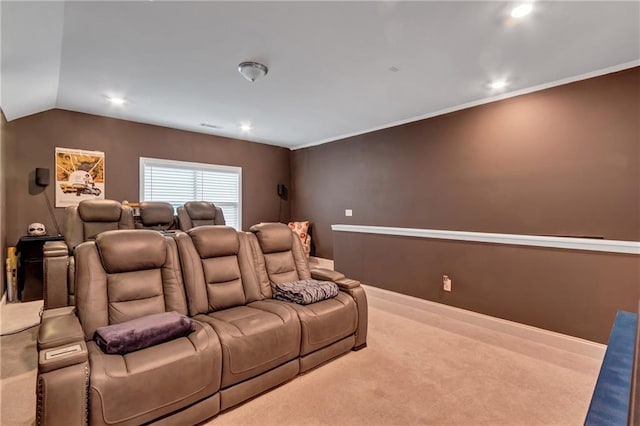 cinema room with lofted ceiling and carpet flooring