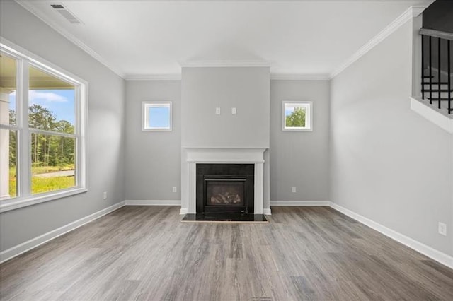 1101 Cooks Farm Way, Woodstock, GA 30189 - unfurnished living room featuring plenty of natural light, wood finished floors, a fireplace with flush hearth, baseboards, and crown molding
