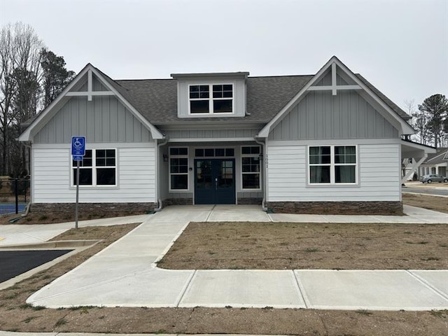 1101 Cooks Farm Way, Woodstock, GA 30189 - view of front of home featuring board and batten siding, a shingled roof, and french doors