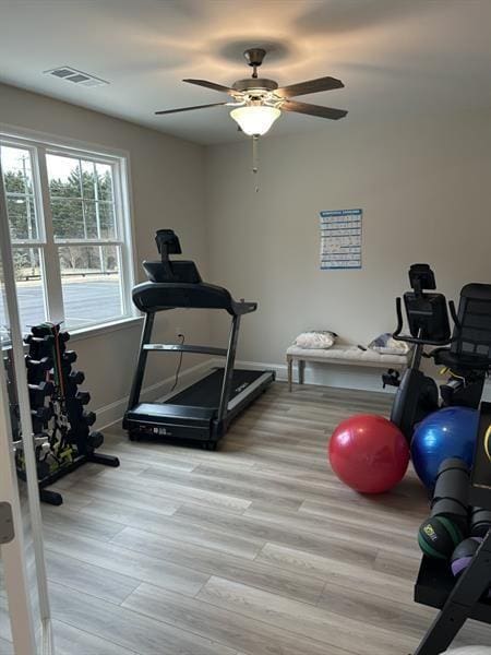 1101 Cooks Farm Way, Woodstock, GA 30189 - exercise area featuring a ceiling fan, light wood finished floors, and baseboards