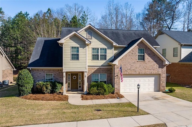 view of front of property with brick siding, concrete driveway, and a front yard