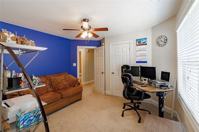 office with ceiling fan, baseboards, and carpet