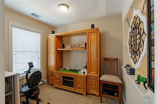 home office featuring visible vents and light colored carpet