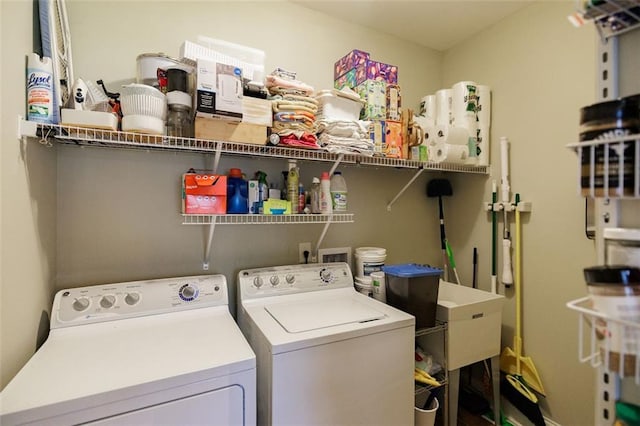 clothes washing area with laundry area and separate washer and dryer