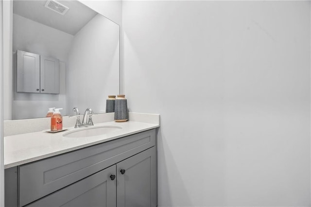 bathroom featuring visible vents and vanity