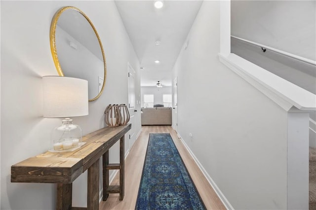 hall with recessed lighting, baseboards, and wood finished floors