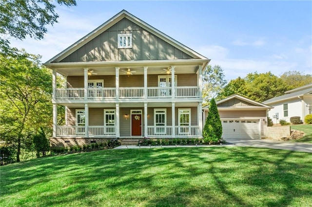 view of front of house with a porch, concrete driveway, a garage, a front lawn, and board and batten siding