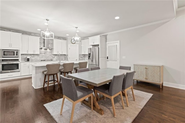 dining area with baseboards, recessed lighting, crown molding, dark wood-style floors, and a notable chandelier