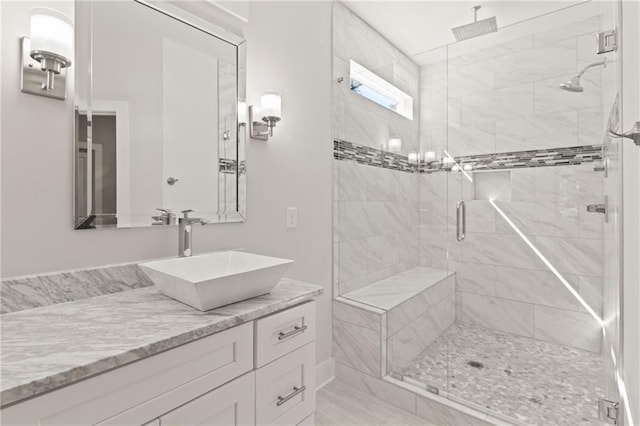 bathroom featuring a stall shower and vanity