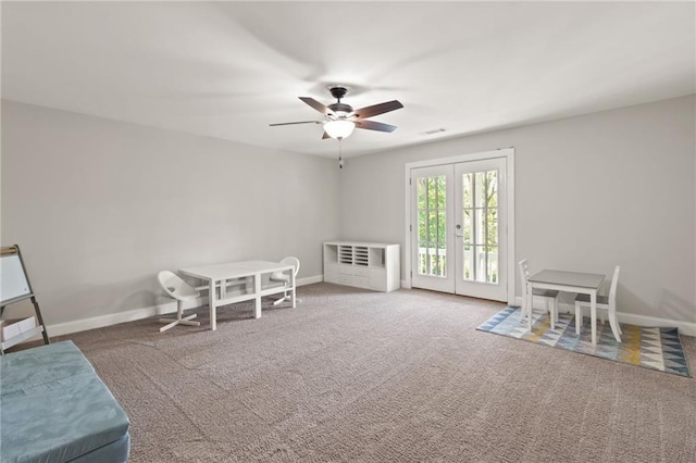 rec room featuring a ceiling fan, baseboards, visible vents, and carpet floors