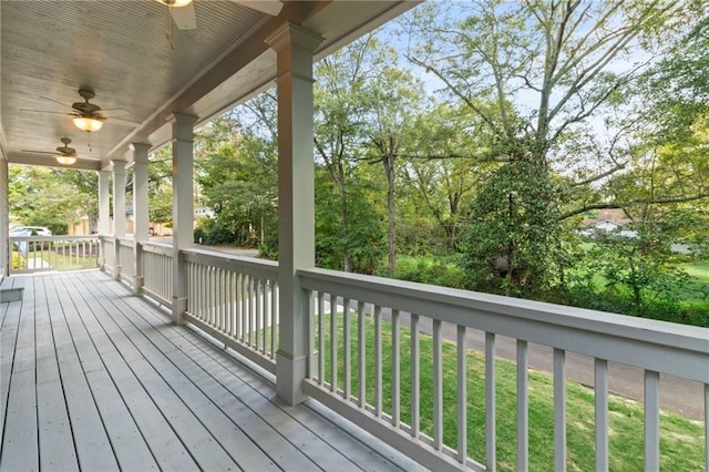 wooden terrace featuring a porch and a ceiling fan