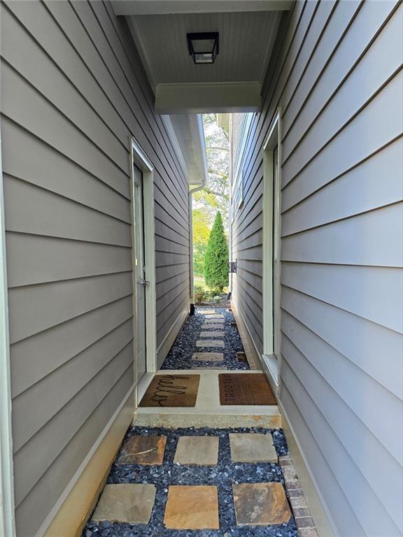 view of home's exterior featuring uncovered parking