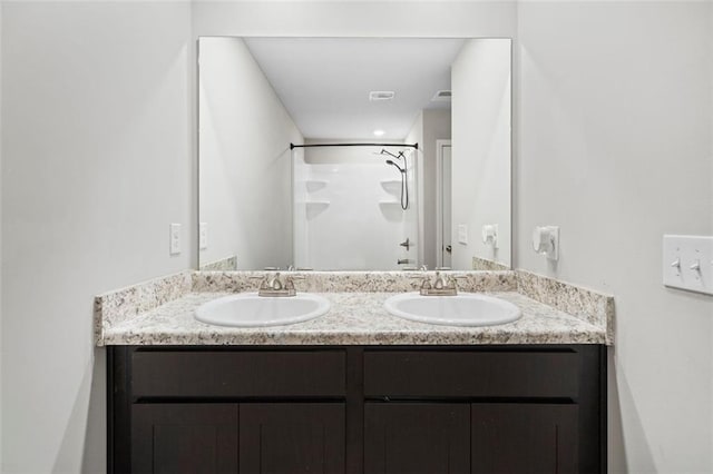 bathroom featuring vanity and walk in shower