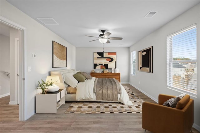 bedroom featuring light wood-type flooring and ceiling fan