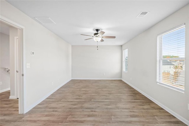 unfurnished room featuring ceiling fan and light wood-type flooring