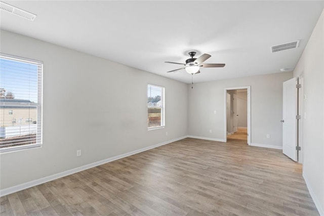 spare room featuring ceiling fan and light hardwood / wood-style flooring