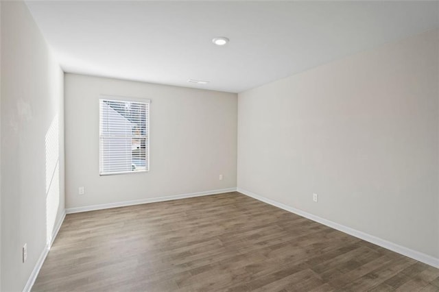 spare room featuring hardwood / wood-style floors