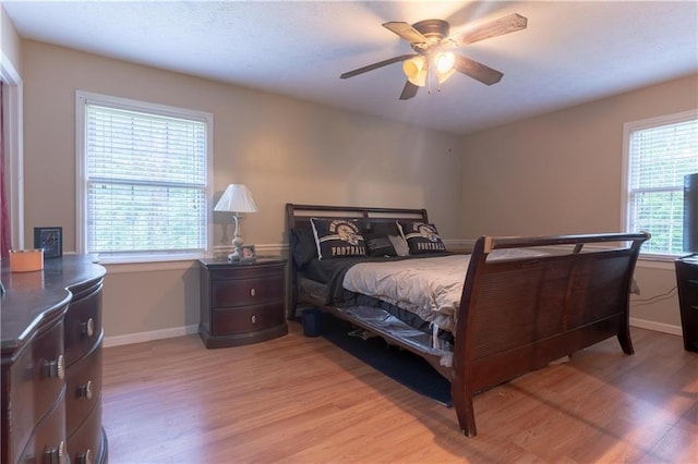 265 Forest Lake Dr, Covington, GA 30016 - bedroom with light wood finished floors and ceiling fan