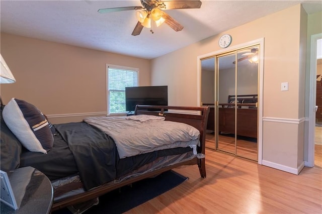 265 Forest Lake Dr, Covington, GA 30016 - bedroom with light wood-type flooring, a closet, and a ceiling fan