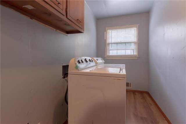 265 Forest Lake Dr, Covington, GA 30016 - washroom featuring light wood finished floors, cabinet space, and separate washer and dryer