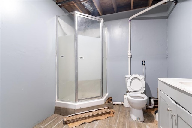 265 Forest Lake Dr, Covington, GA 30016 - bathroom with a shower stall, vanity, and wood finished floors