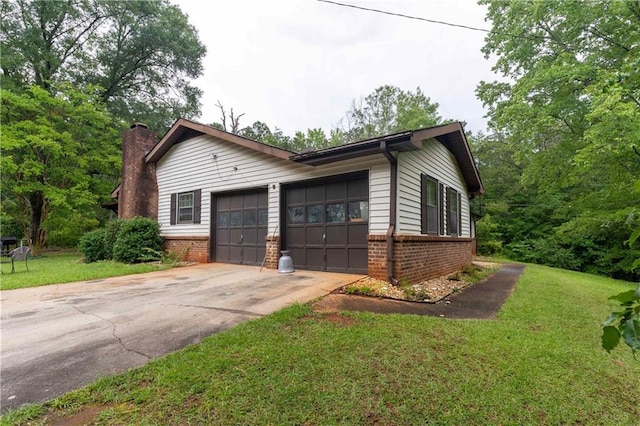 265 Forest Lake Dr, Covington, GA 30016 - view of property exterior with brick siding, a chimney, driveway, a yard, and an attached garage