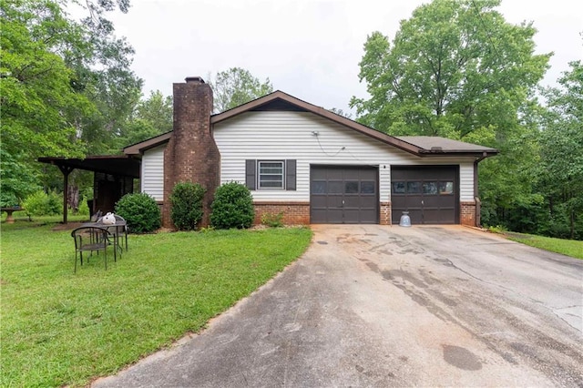 265 Forest Lake Dr, Covington, GA 30016 - view of front of house featuring brick siding, driveway, a front yard, a chimney, and an attached garage