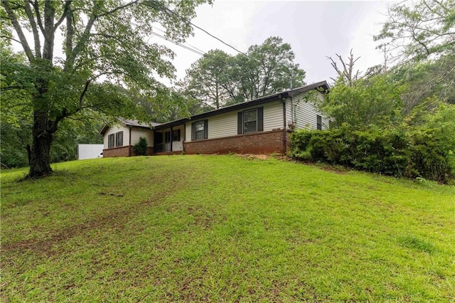 265 Forest Lake Dr, Covington, GA 30016 - single story home with brick siding and a front lawn