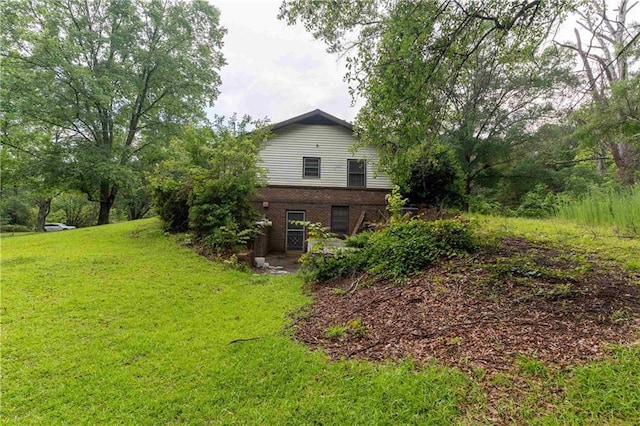 265 Forest Lake Dr, Covington, GA 30016 - view of home's exterior with a yard and brick siding