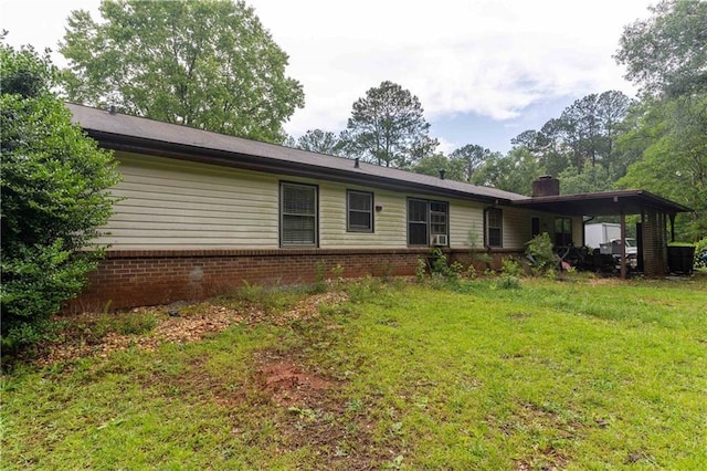 265 Forest Lake Dr, Covington, GA 30016 - rear view of property with a lawn, a chimney, and brick siding