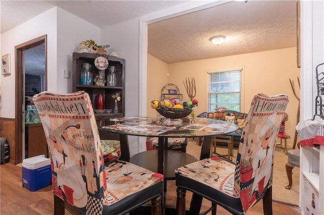 265 Forest Lake Dr, Covington, GA 30016 - dining space with wood finished floors and a textured ceiling