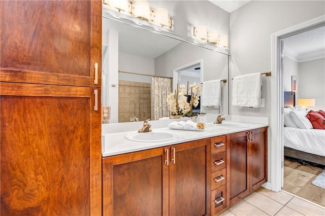 bathroom with crown molding, vanity, a shower with curtain, and tile patterned flooring