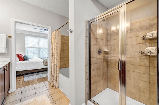 bathroom with tile patterned flooring, a shower with curtain, and a textured ceiling