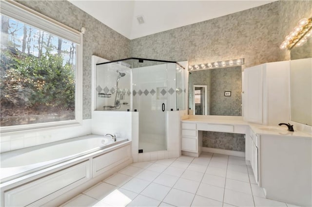 full bathroom featuring tile patterned floors, a shower stall, wallpapered walls, a bath, and vanity