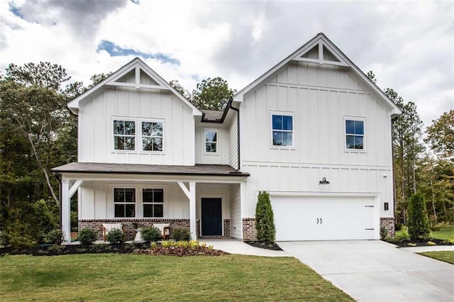 129 Henley St, Canton, GA 30114 - modern inspired farmhouse featuring brick siding, board and batten siding, and an attached garage